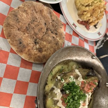 Cafe Landwer - Smoked eggplant with pita bread, side of garlic broccoli and spinach as well as the Farmer's Market cauliflower appetizer - Mediterranean Near Me - Boston, Massachusetts
