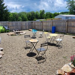 Copper Fox Winery - Outside sitting area with corn hole and a fire pit.