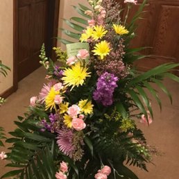 Spray delivered to funeral home (looks like it's missing flowers). Spray delivered to funeral home (looks like it's missing flowers).