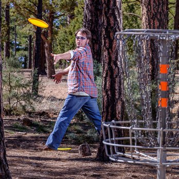 Laird Brown Photography - A professor lining up a disk golf "putt" shows Northland Pioneer College an exciting place to begin a college degree or learn a trade. - Session Photography Near Me - Phoenix, Arizona Laird Brown Photography - A professor lining up a disk golf "putt" shows Northland Pioneer College an exciting place to begin a college degree or learn a trade. - Session Photography Near Me - Phoenix, Arizona