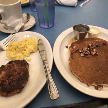 Ria's Bluebird - Pork breakfast sausage, 1 scrambled egg with cheese, pecan pancake. - Southern Near Me - Atlanta, Georgia Ria's Bluebird - Pork breakfast sausage, 1 scrambled egg with cheese, pecan pancake. - Southern Near Me - Atlanta, Georgia