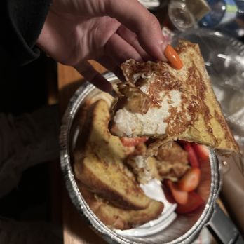 Quick Flame Restaurant and Bar - a person taking a piece of french toast - Bars Near Me - Oshawa, Ontario Quick Flame Restaurant and Bar - a person taking a piece of french toast - Bars Near Me - Oshawa, Ontario