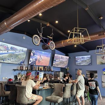 Wakesurf Saloon - Bike hanging from the ceiling - Sports Bars Near Me - Austin, Texas Wakesurf Saloon - Bike hanging from the ceiling - Sports Bars Near Me - Austin, Texas