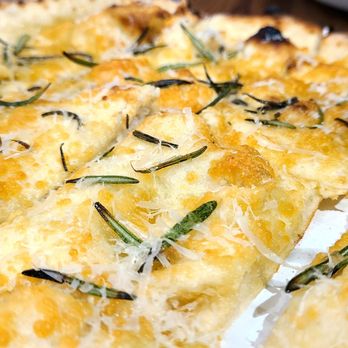 The Doughfellas - Focaccina Rosemary with a side of pizza sauce. Very tasty! - Pizza Near Me - Pompano Beach, Florida