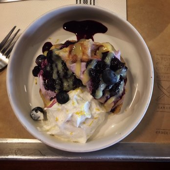 Stone Creek Coffee - Blueberry lemon waffle - Blueberry compote, cream cheese, lemon curd on top of a waffle, served with blueberries and whipped cream. - Breakfast & Brunch Near Me - Milwaukee, Wisconsin
