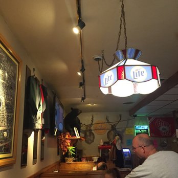Basil's II - a man and a child in a restaurant - American Near Me - Denmark, Wisconsin