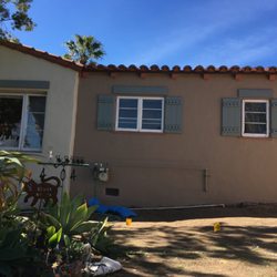 Andy's Custom Painting - Dressing it up with distressed wood header and shutters. that we created,,