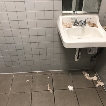 7-Eleven - a bathroom with a sink and mirror - Convenience Stores Near Me - Austin, Texas