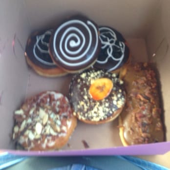 Pinkbox Doughnuts - Swirl: cheesecake filled. Two in the back:oreo care me filled. Fat Elvis: peanut butter and banana. Maple bacon doughnut - Donuts Near Me - Henderson, Nevada