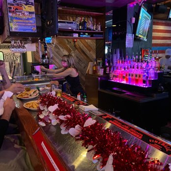 Dillon's KC BBQ Arrowhead - a bartender serving customers - Barbeque Near Me - Glendale, Arizona