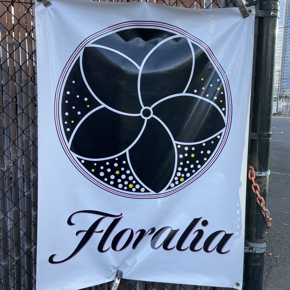 Floralia - a black and white sign on a fence - Italian Near Me - Honolulu, Hawaii