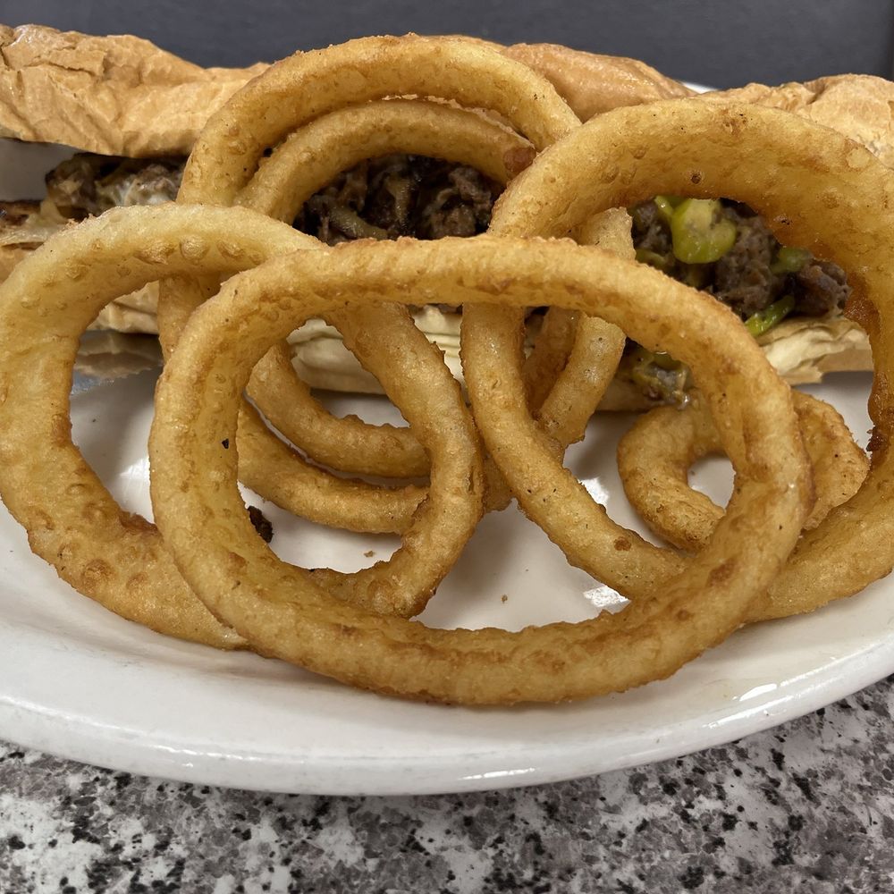 The Original Mels - Delicious Philly Cheesesteak Sandwich w/ Beer Battered Onion Rings - American Near Me - Sacramento, California The Original Mels - Delicious Philly Cheesesteak Sandwich w/ Beer Battered Onion Rings - American Near Me - Sacramento, California