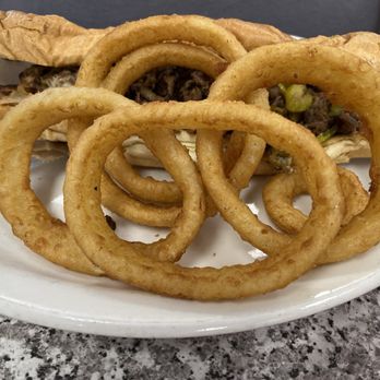 The Original Mels - Delicious Philly Cheesesteak Sandwich w/ Beer Battered Onion Rings - American Near Me - Sacramento, California The Original Mels - Delicious Philly Cheesesteak Sandwich w/ Beer Battered Onion Rings - American Near Me - Sacramento, California