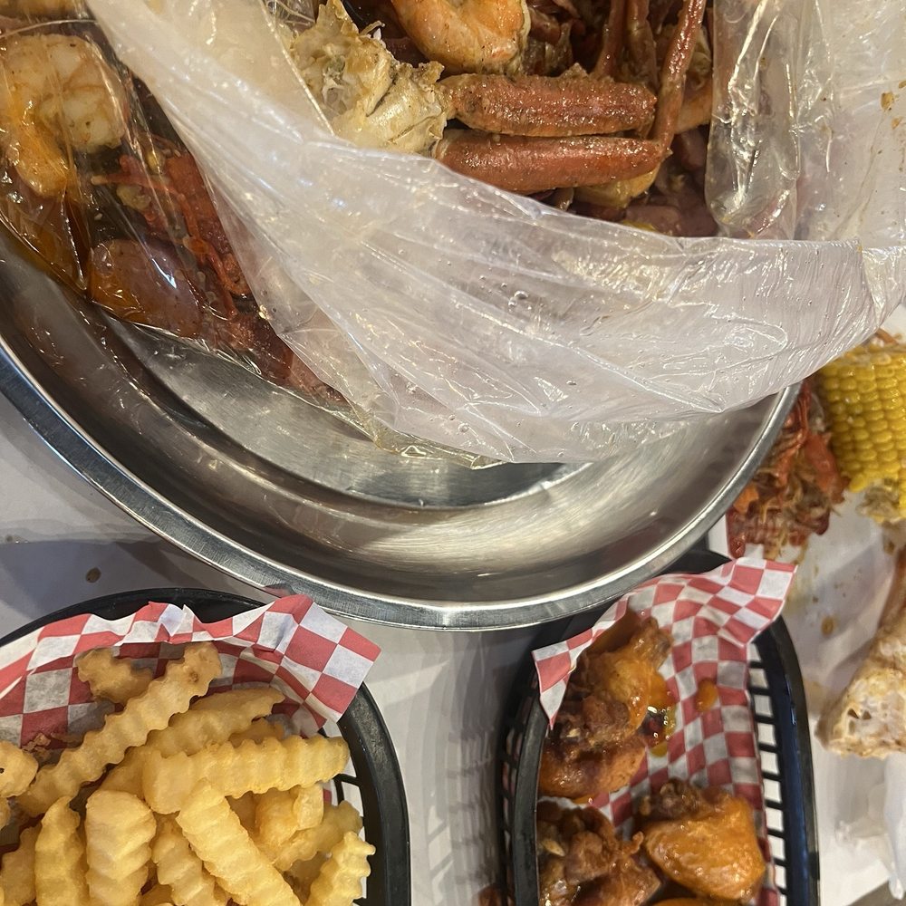 seafood food boil,chicken wings and french friesss.. seafood food boil,chicken wings and french friesss..