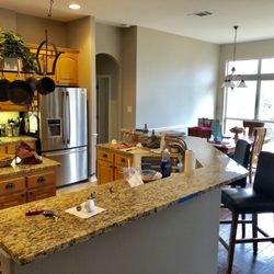 Summit Painting - All walls were red before. We painted a darker shade on the front of the bar and a lighter tone on the dining room and kitchen walls.