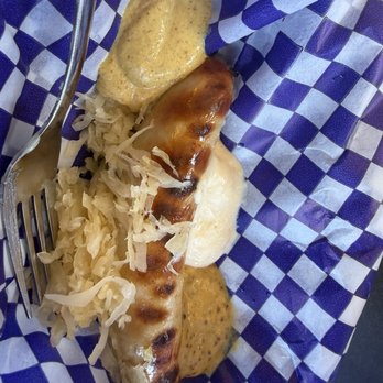 München Haus - There is a brat under the condiments - German Near Me - Leavenworth, Washington München Haus - There is a brat under the condiments - German Near Me - Leavenworth, Washington