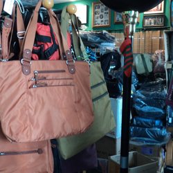 Gene's Luggage - CALL FOR AN APPOINTMENT. Many nylon cross body handbags, to make the trip easy.