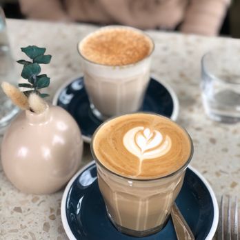 Two Hands - two cups of coffee on a table - Cafes Near Me - Brooklyn, New York Two Hands - two cups of coffee on a table - Cafes Near Me - Brooklyn, New York