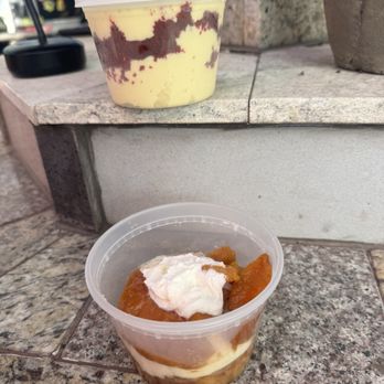 Kingdom Gourmet Cuisine - Top container is red velvet banana pudding bottom peach cobbler cinnamon roll. - Food Trucks Near Me - Austin, Texas Kingdom Gourmet Cuisine - Top container is red velvet banana pudding bottom peach cobbler cinnamon roll. - Food Trucks Near Me - Austin, Texas
