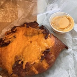 Bacon and cheddar pretzel with cheddar dip Bacon and cheddar pretzel with cheddar dip