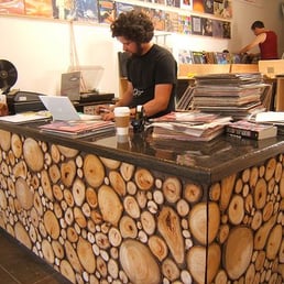 The owners built the desk and vinyl shelving themselves.