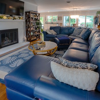 Re-Builders - a living room with blue leather furniture - General Contractors Near Me - Myrtle Beach, South Carolina