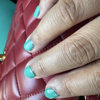 Classy Nail Spa - The gel nail polish on the middle finger is lifting off of the nail. - Nail Salons Near Me - Alameda, California