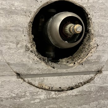 Piedmont Construction Consultants - Water leaking from behind shower wall, pipe and shower head not screwed on correctly from Piedmont Construction Company LLC - Damage Restoration Near Me Piedmont Construction Consultants - Water leaking from behind shower wall, pipe and shower head not screwed on correctly from Piedmont Construction Company LLC - Damage Restoration Near Me