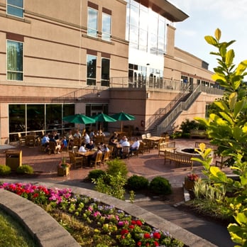 Prairie River - a view of a restaurant with tables and umbrellas - New American Near Me - Itasca, Illinois Prairie River - a view of a restaurant with tables and umbrellas - New American Near Me - Itasca, Illinois