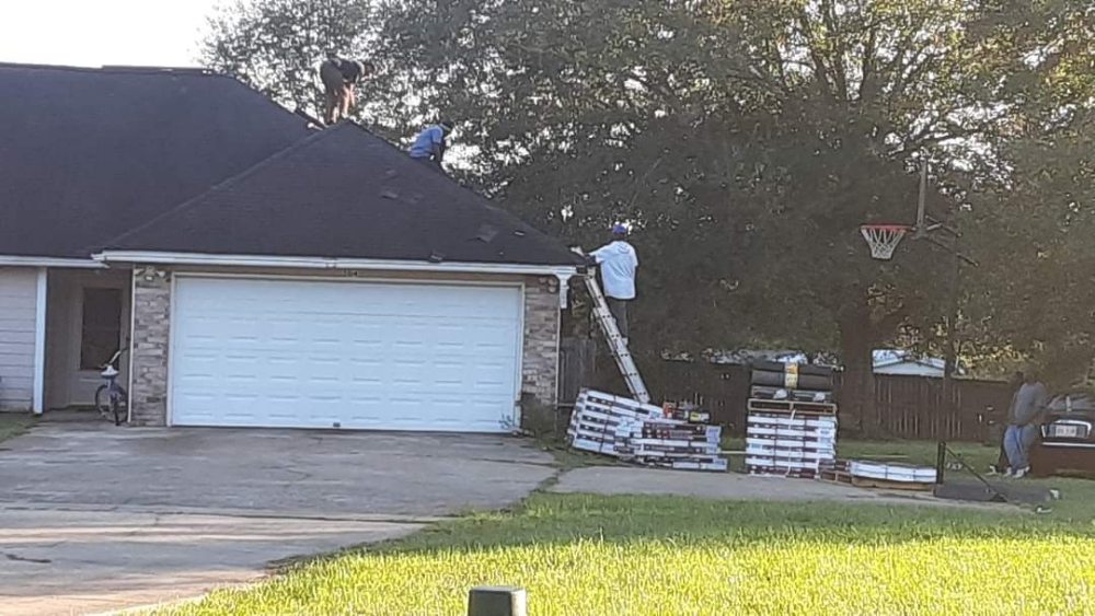 Slide of Hooker Roofing