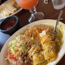 Toreros Fine Mexican Food - Enchiladas verde cut, with side rice and salad. Strawberry margarita