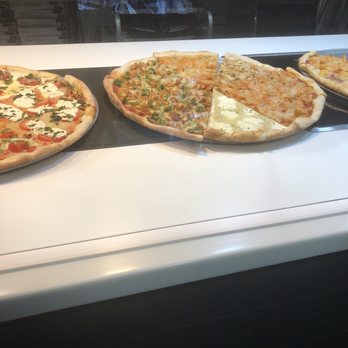 Enzo Claudio Pizzeria - three pizzas on display - Pizza Near Me - New York, New York Enzo Claudio Pizzeria - three pizzas on display - Pizza Near Me - New York, New York