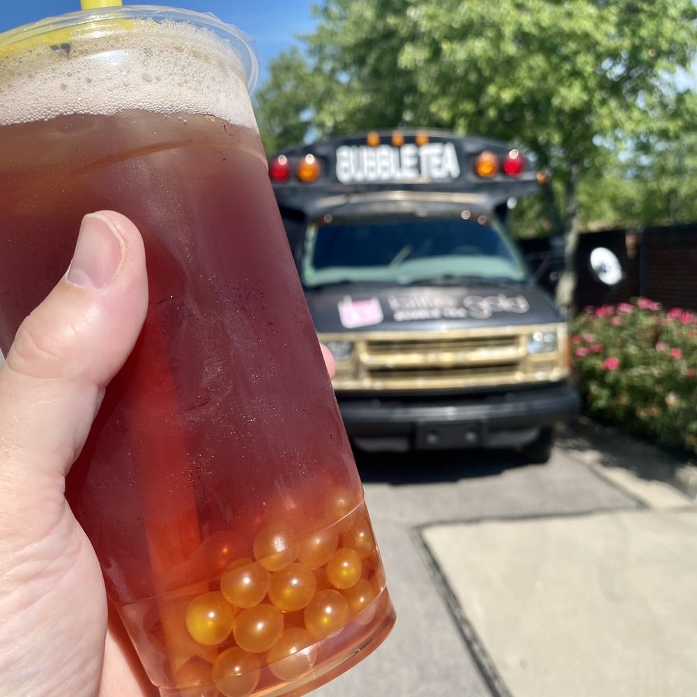 Billie Gold Bubble Tea - a hand holding a cup of bubble tea - Food Trucks Near Me