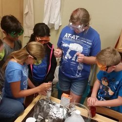 Community Montessori School - Upper Elementary students conducting an experiment