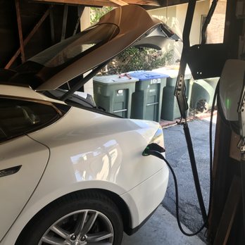 Trout Electric - Car charging in the garage, using a new Tesla charger - Electricians Near Me - Corona, California