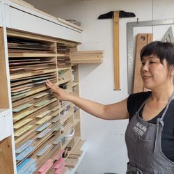 Kathy giving a studio tour. Those are templates for handbuilding.