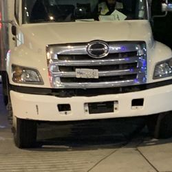 Quick As A Wink Courier Service - Truck blocking sidewalk with cars needing to exit on his right.