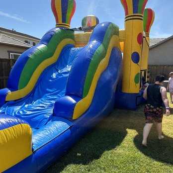 Kids Bouncing Fun - Wet slide - Bounce House Rentals Near Me