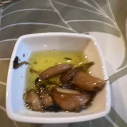 Tavola - Baked garlic clove in olive oil-- yum!