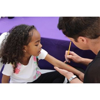 OC Face Paint - Own Nina painting a carrot for this little bunny. - Makeup Artists Near Me OC Face Paint - Own Nina painting a carrot for this little bunny. - Makeup Artists Near Me