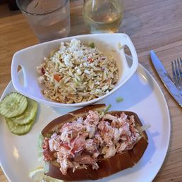 Lobster roll and orzo salad. Lobster roll and orzo salad.