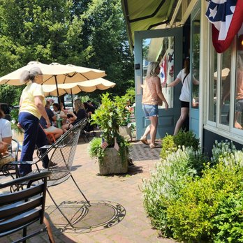 Harborview Market - people sitting at tables and umbrellas - Delis Near Me - Bridgeport, Connecticut