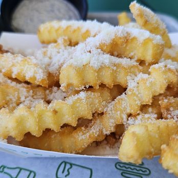 Shake Shack Huntington Beach - Parmesan fries with black truffle dip - Burgers Near Me - Huntington Beach, California Shake Shack Huntington Beach - Parmesan fries with black truffle dip - Burgers Near Me - Huntington Beach, California