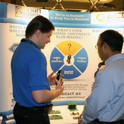 ACE Data Recovery - ACE Data Recovery expert showing proprietary hardware at IT conference
