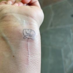 Anomaly Lifestyle Art & Tattoo - poppy fine line tattoo