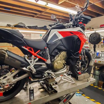 Munroe Motors - Munroe service department installing the MS crash bars before riding her home. - Motorcycle Dealers Near Me - San Francisco, California Munroe Motors - Munroe service department installing the MS crash bars before riding her home. - Motorcycle Dealers Near Me - San Francisco, California