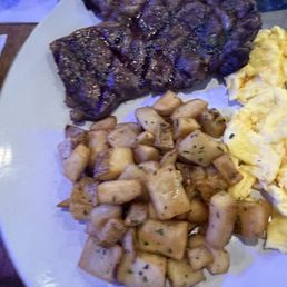Ribeye and Eggs with home fries Ribeye and Eggs with home fries