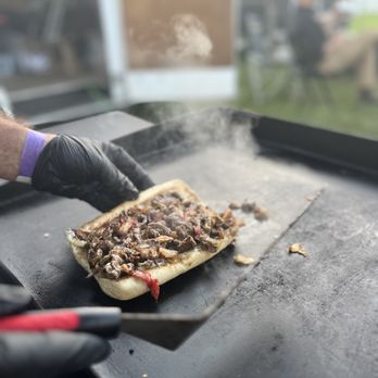 Kitchen 304 - a person cutting a sandwich on a grill - Pop-Up Restaurants Near Me - Maxwelton, West Virginia Kitchen 304 - a person cutting a sandwich on a grill - Pop-Up Restaurants Near Me - Maxwelton, West Virginia
