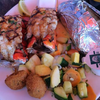 Pompano Joe's - Twin tails lobster entree - Seafood Near Me - Destin, Florida Pompano Joe's - Twin tails lobster entree - Seafood Near Me - Destin, Florida