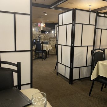 Taverna Rodos - a woman sitting at a table - Greek Near Me - Winnipeg, Manitoba Taverna Rodos - a woman sitting at a table - Greek Near Me - Winnipeg, Manitoba